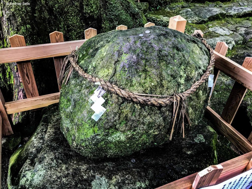 Sacred rock at Nachi Waterfall in Japan at the Hiro Jinja Shinto Shrine. Photo by Sydney Solis. 